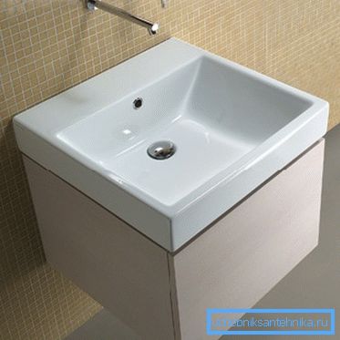 Neat half-meter washbasin with hanging pedestal Neat half-meter washbasin with hanging pedestal