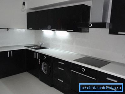 White table top and black sink in modern kitchen interior White table top and black sink in modern kitchen interior