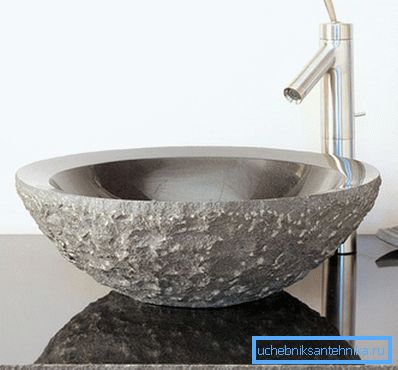 Bowl sink and countertop made of natural stone. Bowl sink and countertop made of natural stone.