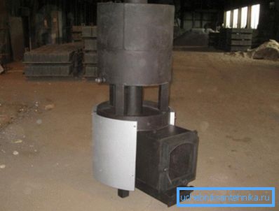 Cast iron stove with tank.