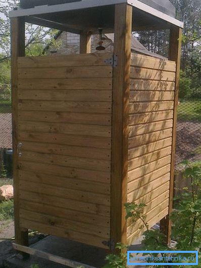 Wooden walls for a summer shower will perfectly fit into a country landscape. Wooden walls for a summer shower will perfectly fit into a country landscape.
