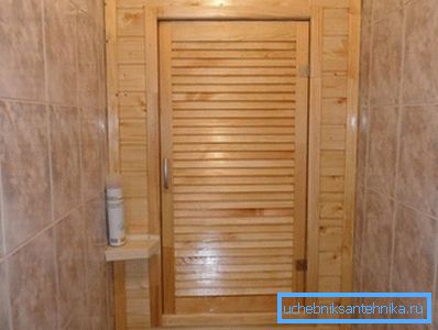 Wooden cabinet. The wall is made of clapboard, the door is made of thin slats. Wooden cabinet. The wall is made of clapboard, the door is made of thin slats.