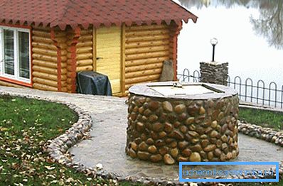 Photo of a stone well Photo of a stone well