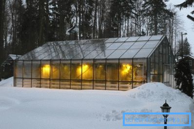 Photo of a greenhouse heated in winter Photo of a greenhouse heated in winter