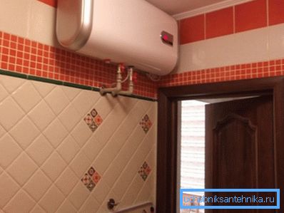 Horizontal tank under the ceiling of the bathroom.