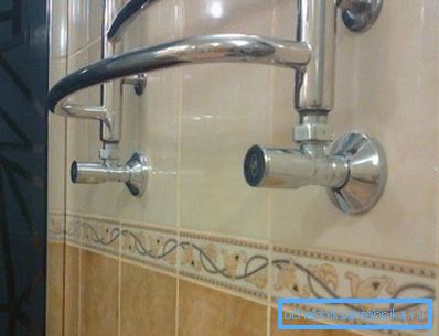 Chrome corner tap connected to towel warmer Chrome corner tap connected to towel warmer