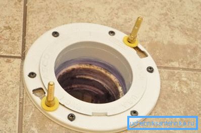 How to fix the toilet to the floor with a vertical release