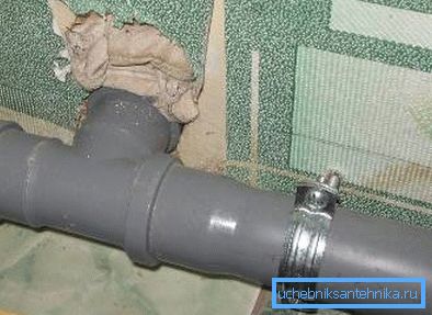 Sewer pipe fixed with a hose clamp Sewer pipe fixed with a hose clamp