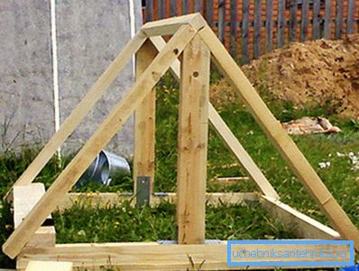 The frame of the roof of the well house.