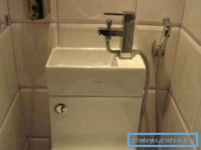 Compact sink on the tank with a shower connection. Compact sink on the tank with a shower connection.