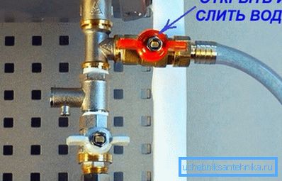 Tap for water discharge with a hose connected to the fitting Tap for water discharge with a hose connected to the fitting