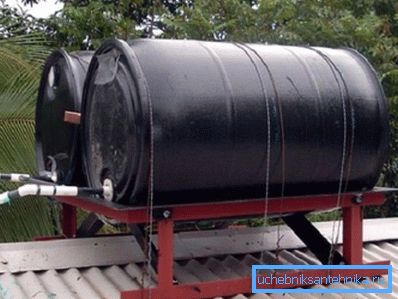 Round metal barrels in black. Round metal barrels in black.