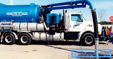 Amateur photo of a large industrial car on a car chassis at the time of cleaning the sewer system Amateur photo of a large industrial car on a car chassis at the time of cleaning the sewer system