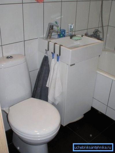 Small sink with cupboard for a small area toilet Small sink with cupboard for a small area toilet