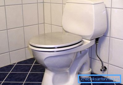 Installation of a toilet bowl of a system a compact on a floor from a ceramic tile. Installation of a toilet bowl of a system a compact on a floor from a ceramic tile.