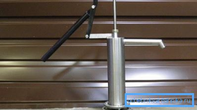 In the photo - the design of a manual water pump. In the photo - the design of a manual water pump.