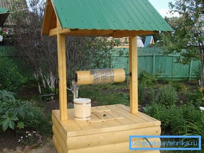 In the photo - the design of a water source in the form of a log In the photo - the design of a water source in the form of a log