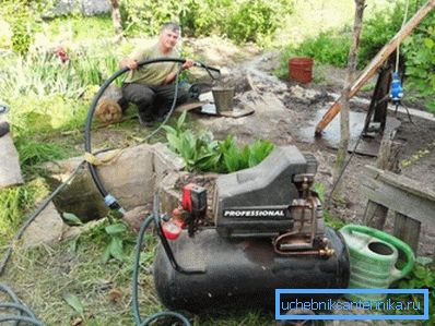On a photo - pumping of a well after drilling On a photo - pumping of a well after drilling