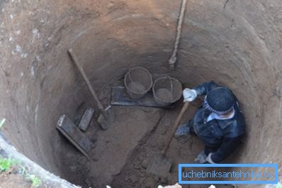In the photo - the deepening of the well on a country site In the photo - the deepening of the well on a country site