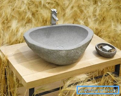 The photo shows a bowl of natural marble.
