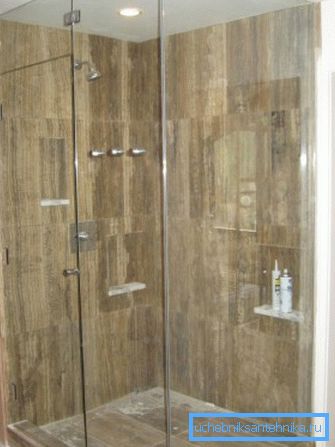 In the photo shower enclosure.