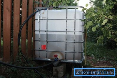 In the photo - a container with a tap with water on the site In the photo - a container with a tap with water on the site