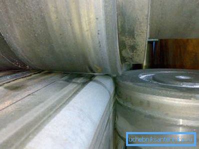 In the photo, the formation of a round billet rolls In the photo, the formation of a round billet rolls