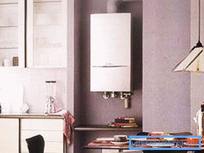 On the photo - gas heating boiler mounted on the wall On the photo - gas heating boiler mounted on the wall