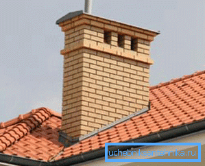 In the photo - a brick pipe for removal of exhaust gases from the furnace