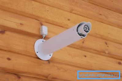 In the photo - coaxial chimney in a wooden house In the photo - coaxial chimney in a wooden house