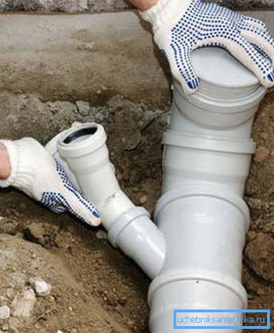 In the photo - installation of plastic pipes with a socket In the photo - installation of plastic pipes with a socket
