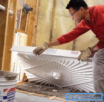 In the photo - a low pallet in the process of laying on a pillow of cement In the photo - a low pallet in the process of laying on a pillow of cement