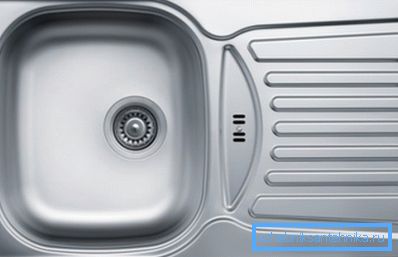 The photo shows the overhead metal sink-tabletop. The photo shows the overhead metal sink-tabletop.
