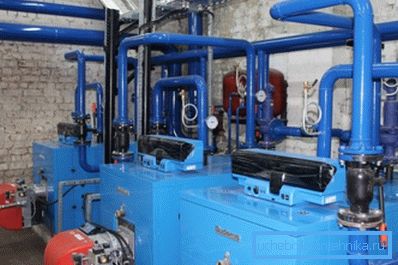 The photo shows the total boiler room of an apartment building. The photo shows the total boiler room of an apartment building.