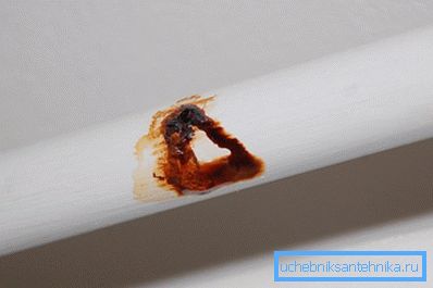 The photo shows how corrosion destroys a steel pipe. The photo shows how corrosion destroys a steel pipe.