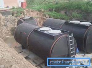 The photo shows storage tanks in the ground. The photo shows storage tanks in the ground.