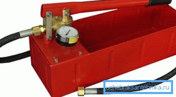 In the photo - a device for crimping heating systems