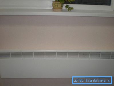 The photo shows an example of mounting a wall convector. The photo shows an example of mounting a wall convector.