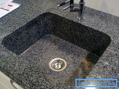 On a photo - a sink from an artificial stone
