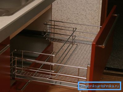 In the photo there is a grid for drying dishes under the sink. In the photo there is a grid for drying dishes under the sink.
