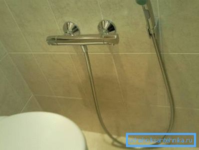 In the photo - a mixer equipped with a thermostat.
