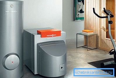 The photo shows a solid fuel boiler with electric and heat accumulator. The photo shows a solid fuel boiler with electric and heat accumulator.