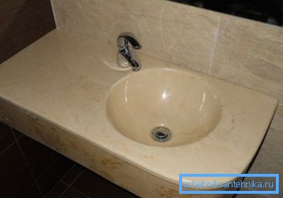 The photo shows a washbasin made of acrylic artificial stone. The photo shows a washbasin made of acrylic artificial stone.