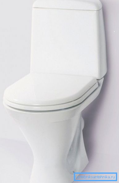 In the photo - a toilet with a flush cistern mounted on the bowl. In the photo - a toilet with a flush cistern mounted on the bowl.