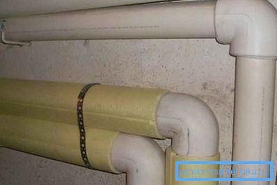 On a photo - the warmed pipes of heating indoors On a photo - the warmed pipes of heating indoors