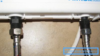 In the photo - inlet and outlet connections. They are supplied with pipe thread size DN 15.