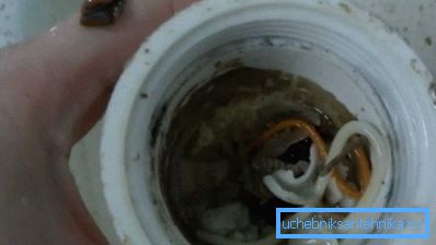 The photo shows a siphon clogged sink.