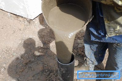 In the photo - pouring the pipe with cement mortar