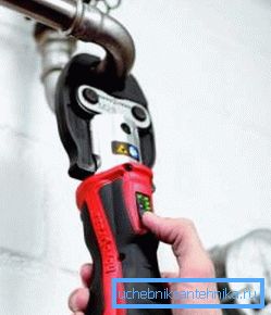 In the photo - clamp using an electric tool In the photo - clamp using an electric tool