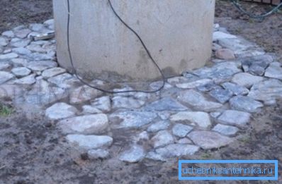 On the third - we place the stone in the concrete mass, in the photo - the result of the work, when the concrete hardens